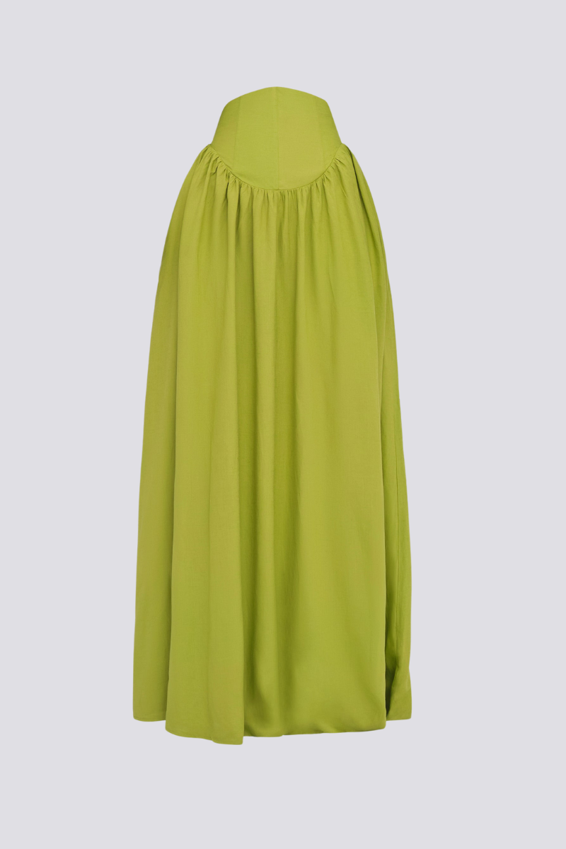 Green - Full-length studio shot of a woman wearing a vibrant lime green two-piece set, featuring a long-sleeved cropped top with ruched arms and matching high-waisted, wide-leg trousers.