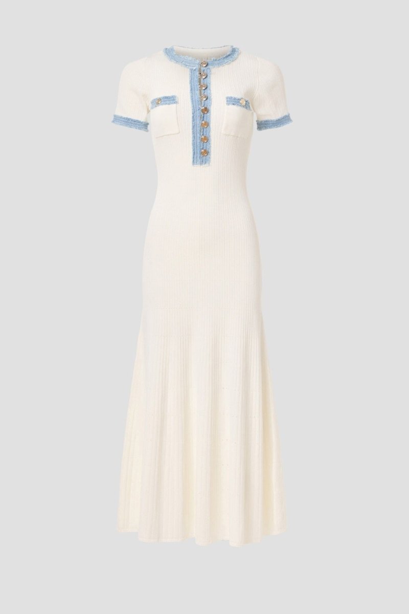 White - Full-length view of a woman wearing a short-sleeved, cream ribbed knit midi dress featuring a blue frayed trim on the crew neck, button placket, and chest pockets.