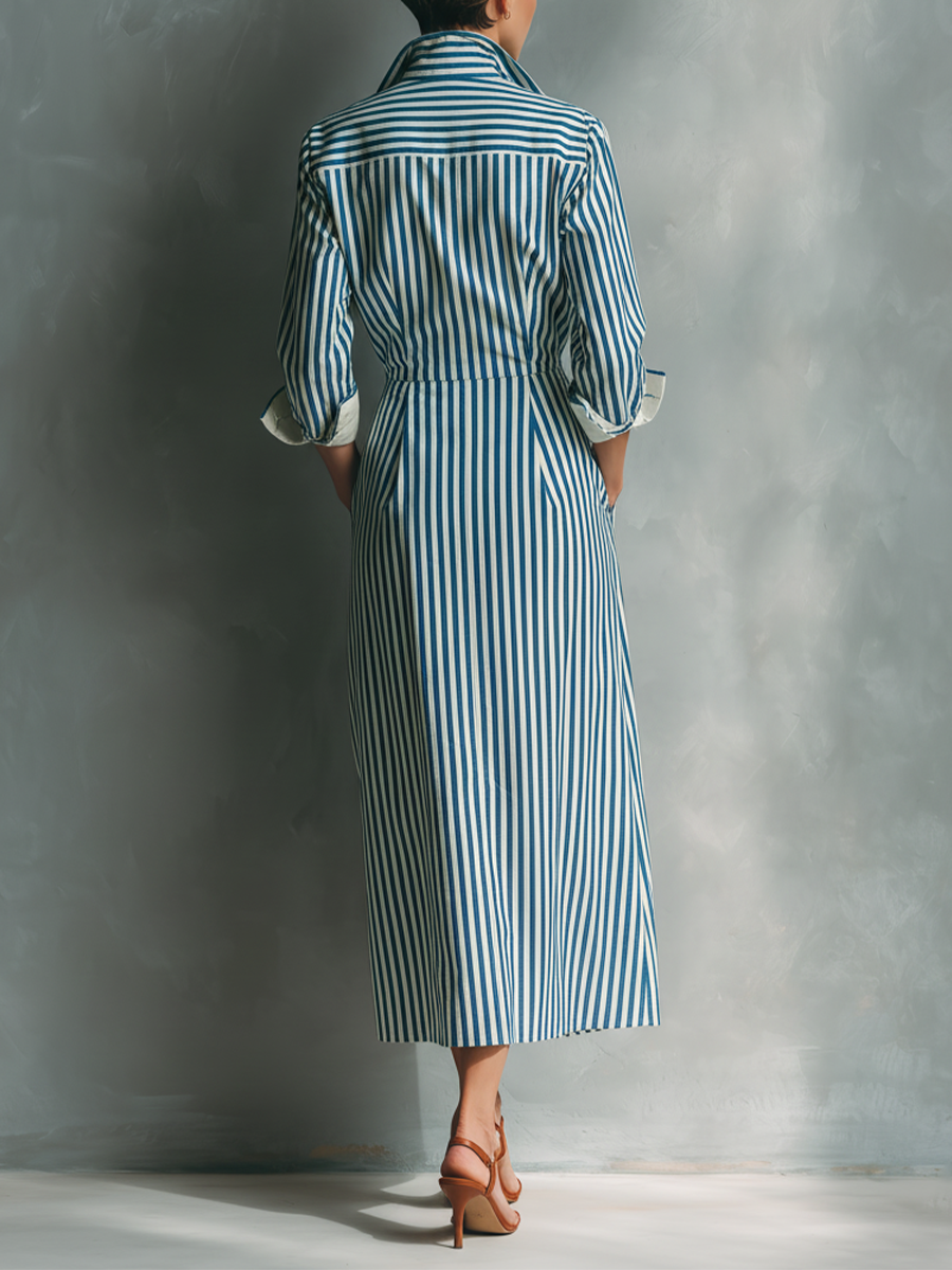 Black And White - Model wearing a striped button-down midi shirtdress with a collar, long sleeves, and a contrast chest pocket.