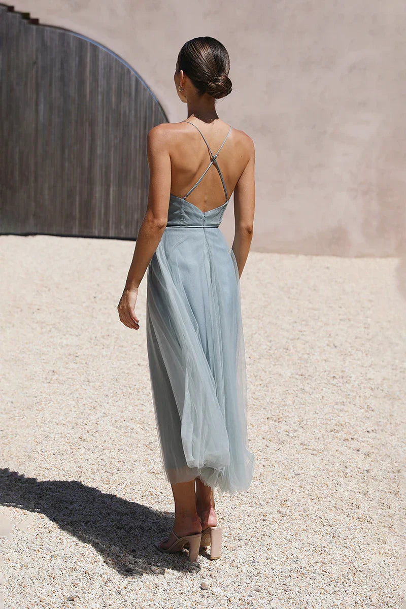 Woman in dusty blue tulle midi dress