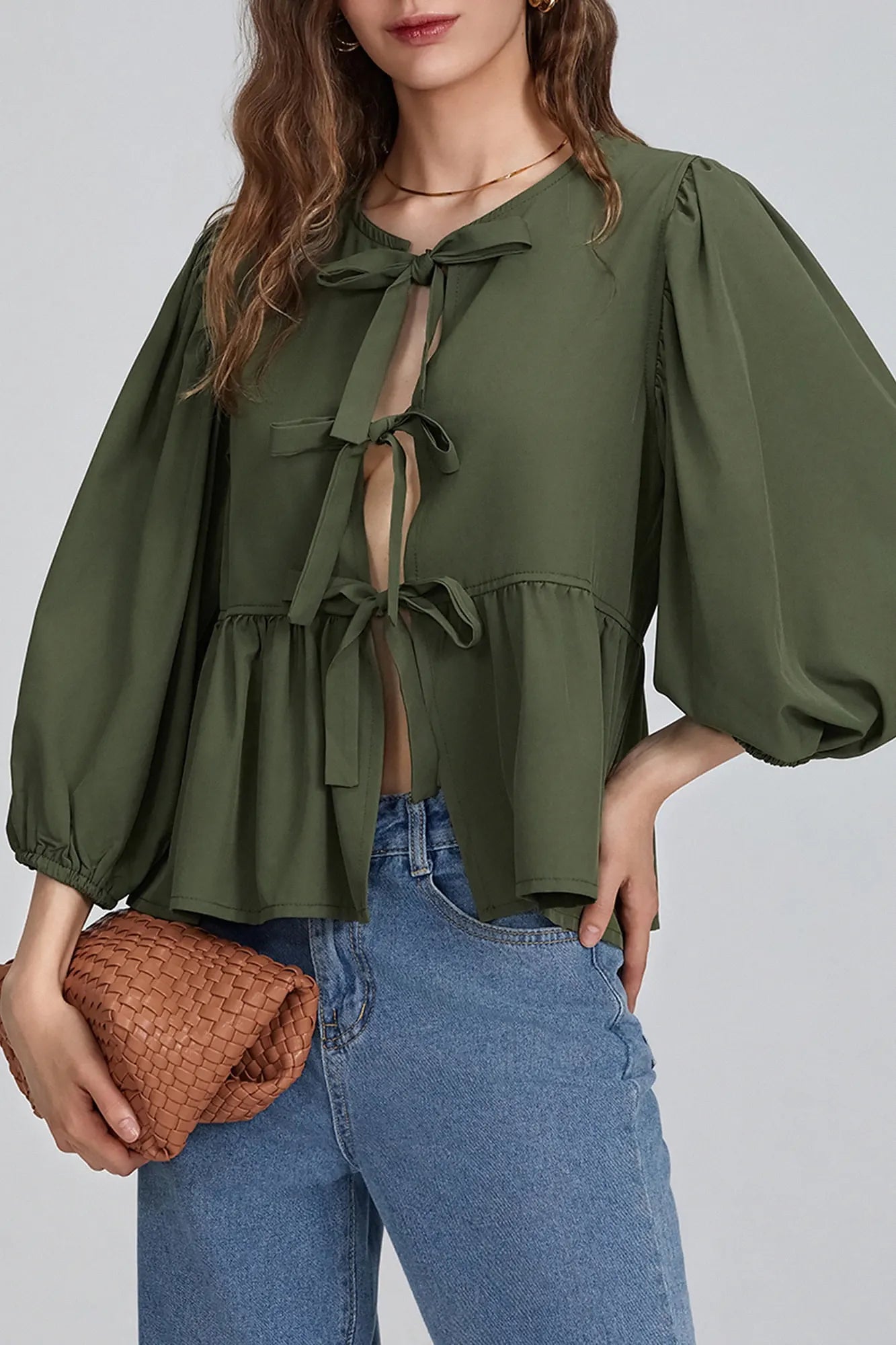 Green - Women's crisp white blouse featuring a split front with three bow ties, voluminous 3/4 length puff sleeves, and a gathered peplum hem.