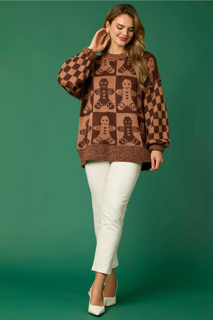 Brown - Women's oversized knit jumper featuring a festive red and white candy cane and checkerboard pattern, styled with drop shoulders and a crew neckline.