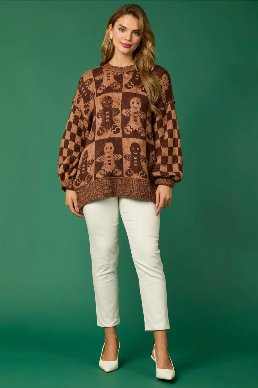 Brown - Women's oversized knit jumper featuring a festive red and white candy cane and checkerboard pattern, styled with drop shoulders and a crew neckline.