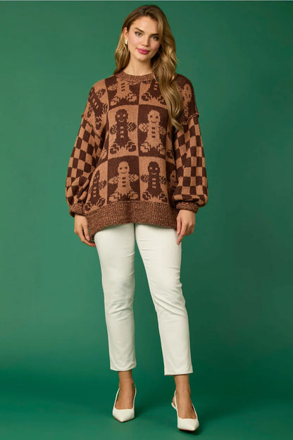 Brown - Women's oversized knit jumper featuring a festive red and white candy cane and checkerboard pattern, styled with drop shoulders and a crew neckline.