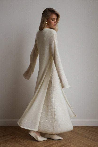 White - A woman modeling a fuzzy white ribbed knit maxi dress paired with a matching longline duster cardigan, showcasing a sleek and elegant winter silhouette.