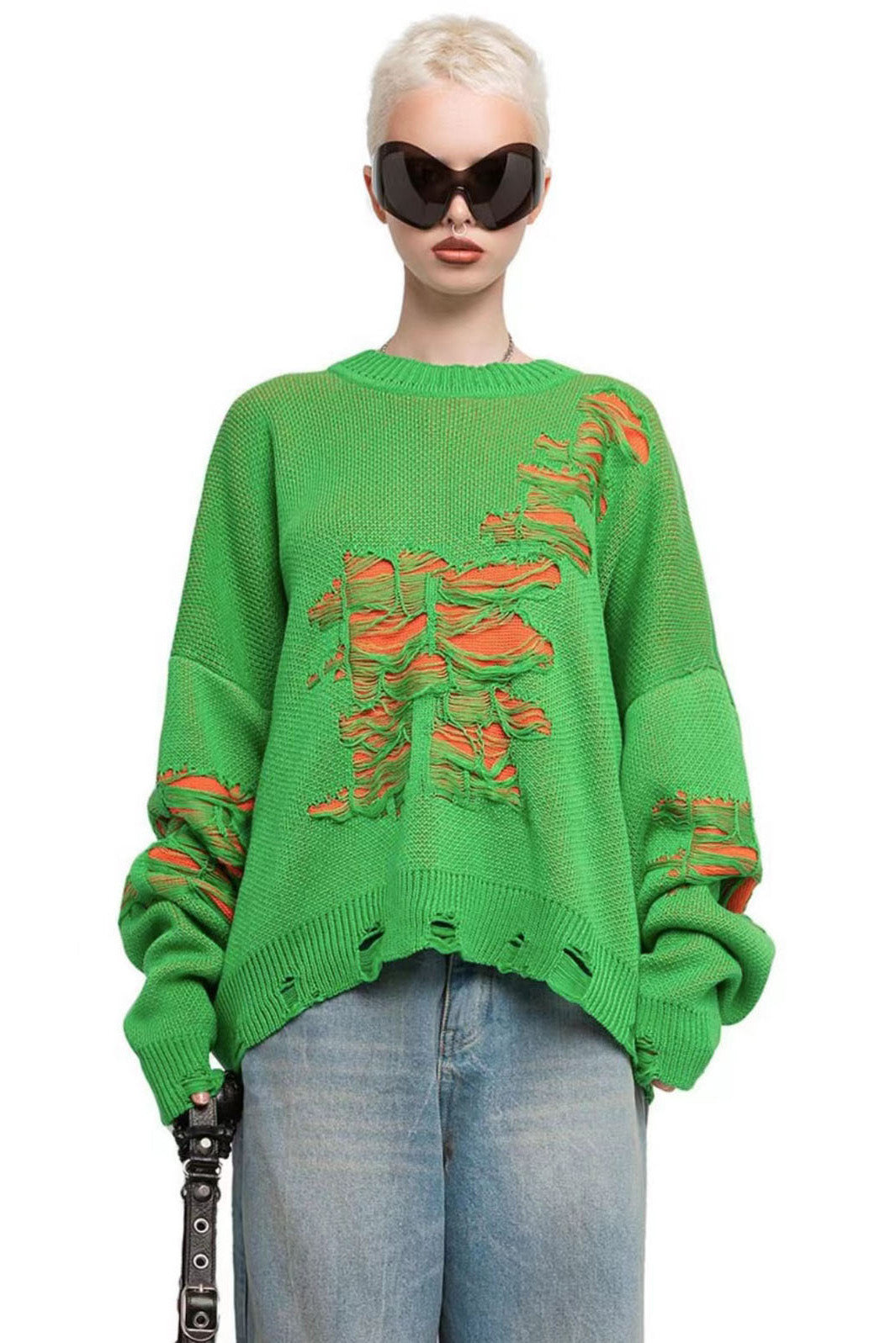 Green - Model wearing a women's oversized black knit jumper featuring heavy distressed laddering and cut-outs, styled with a white mini skirt.