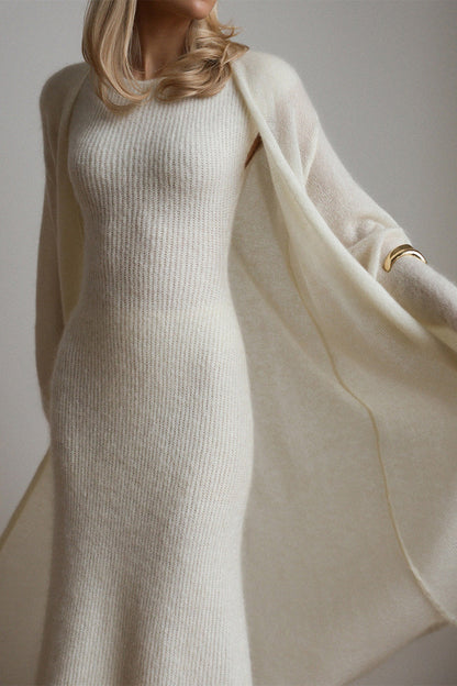 White - A woman modeling a fuzzy white ribbed knit maxi dress paired with a matching longline duster cardigan, showcasing a sleek and elegant winter silhouette.
