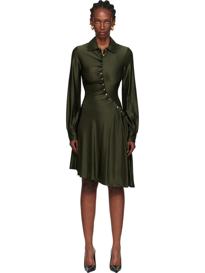 Black - Full-length view of a woman wearing a long-sleeved, knee-length shirt dress in a lustrous olive green, featuring an asymmetrical button front, ruched detailing, and an uneven hem.