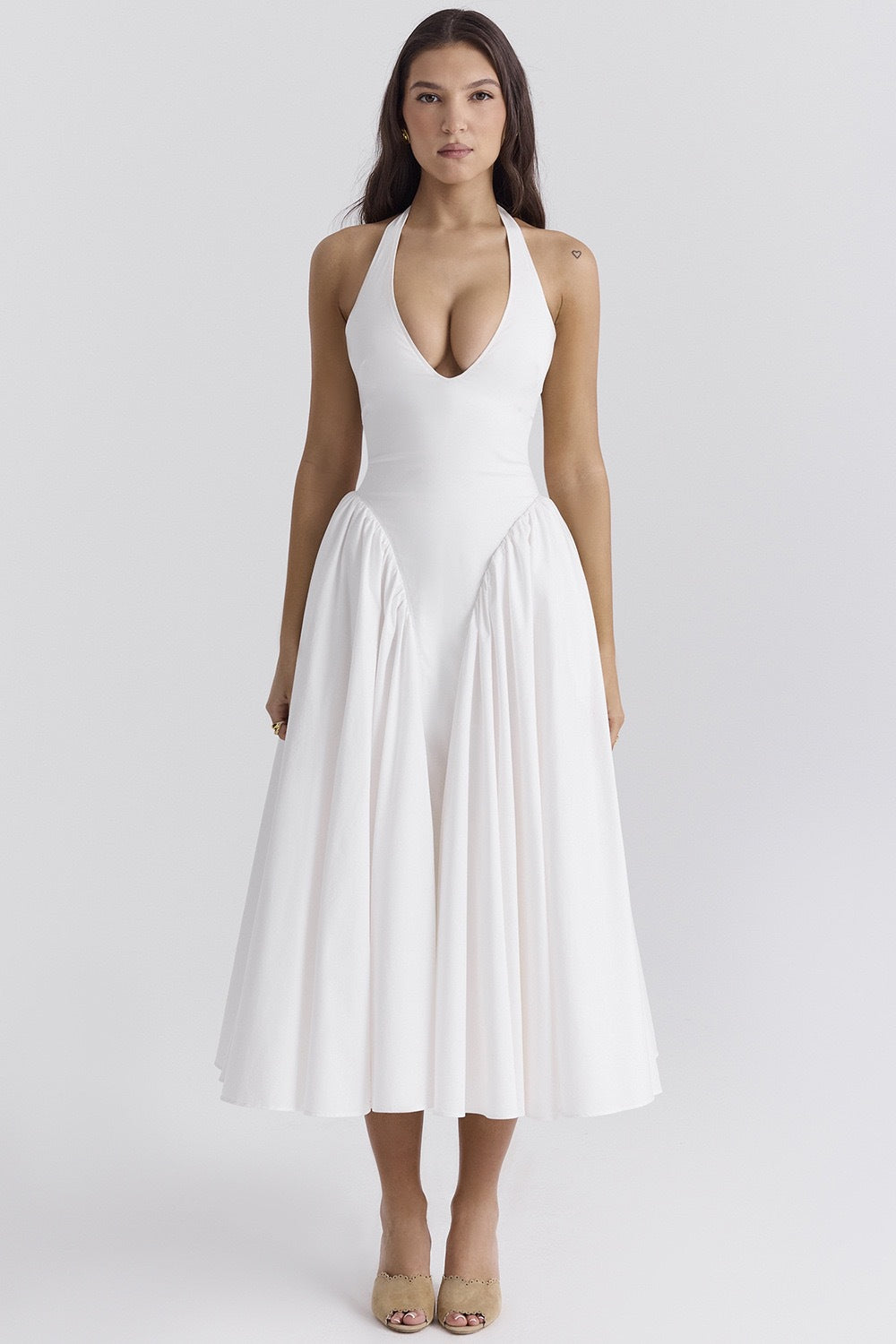 White - A woman models a white sleeveless midi dress with a deep V-neck halter top, a fitted bodice, and a full, gathered A-line skirt, against a plain white background.