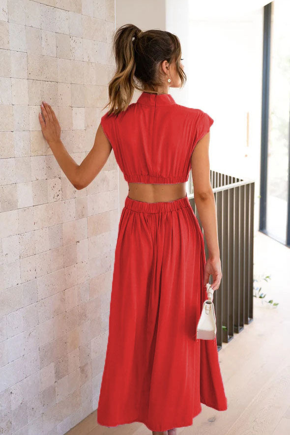 Red - A woman models a pale yellow, high-neck, sleeveless midi dress with a ruched bodice, a side waist cut-out, and a full, flowing A-line skirt, standing outdoors.