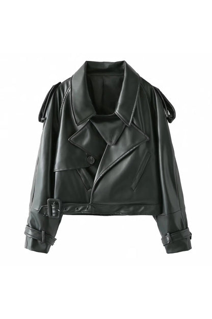 Dark Green - A woman wearing a burgundy oversized faux leather jacket with wide lapels, belted cuffs, and voluminous sleeves, styled over a black turtleneck in a city setting.