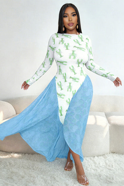 Woman in pink lobster print mesh dress with green flowing skirt and a green purse.