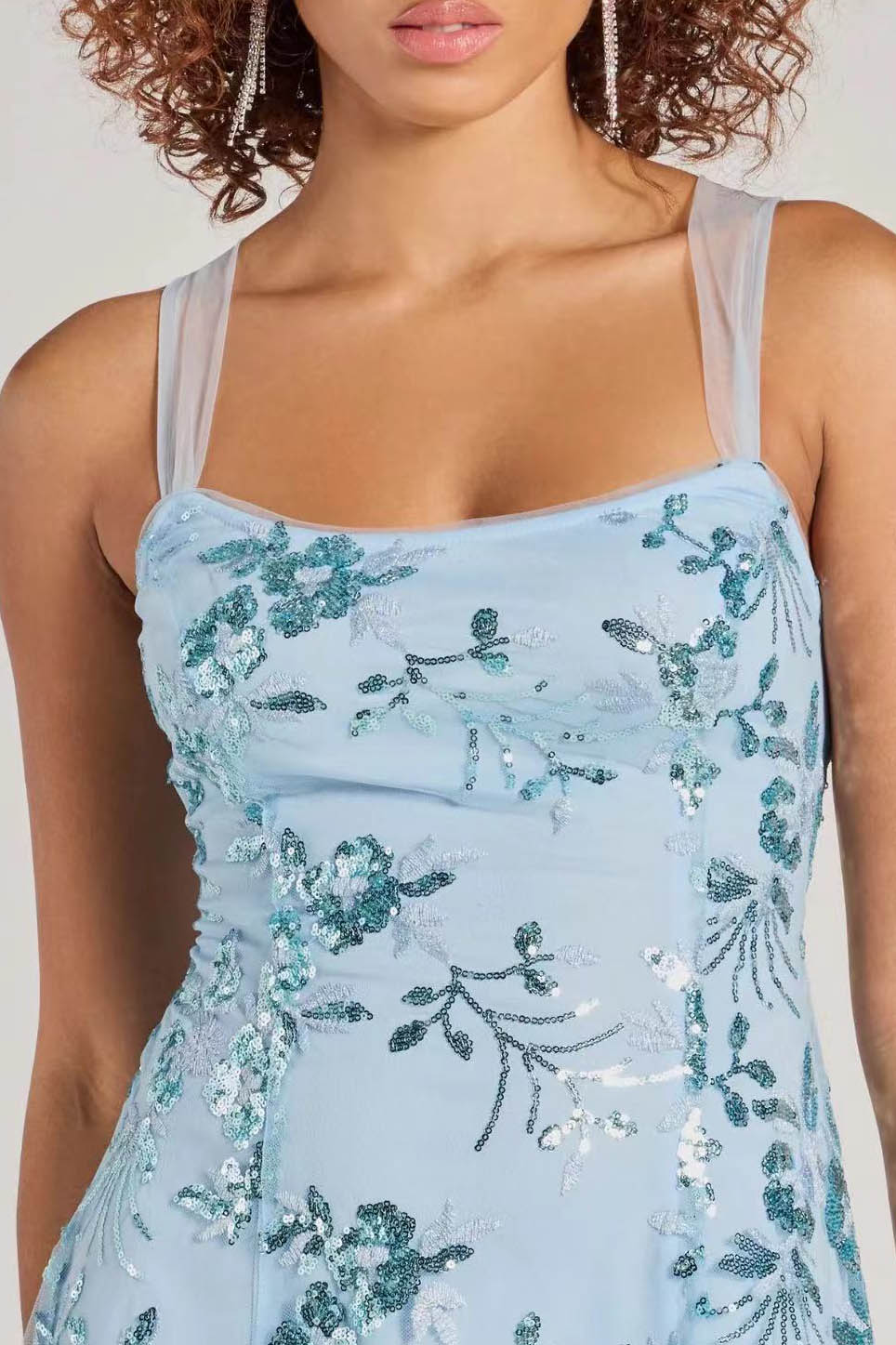 Blue - A woman stands in a full-length pose wearing a lavender, sleeveless, A-line mini dress with a square neckline, featuring all-over tonal purple sequin floral embroidery, against a plain studio background.