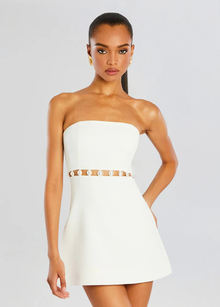 White - Women's elegant white strapless mini dress featuring a structured A-line silhouette and a distinctive waist cut-out adorned with large pearl embellishments.