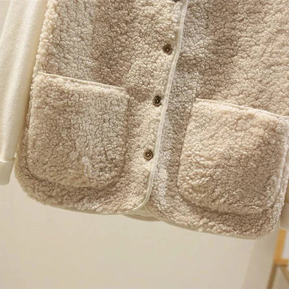 Khaki - Three women's faux shearling vests in cream, dark brown, and taupe hanging on wooden hangers, featuring a V-neck, button-front closure, and large patch pockets.