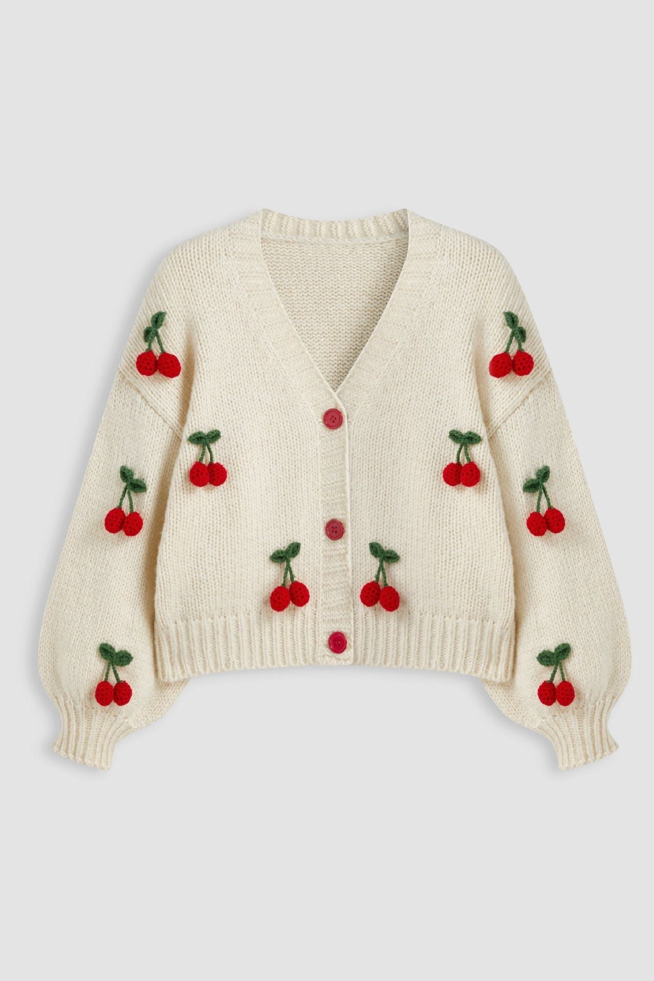 Apricot - Women's chunky knit V-neck cardigan featuring large front buttons and playful 3D crochet cherry appliqués scattered across a relaxed silhouette.