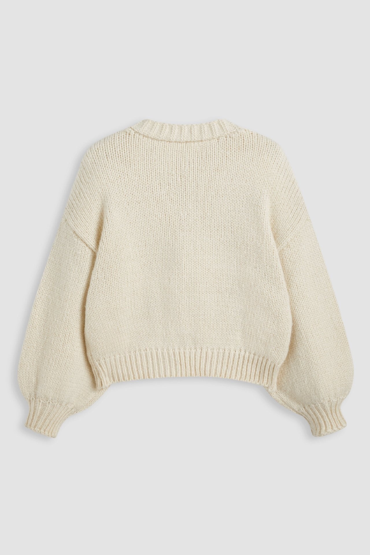 Apricot - Women's chunky knit V-neck cardigan featuring large front buttons and playful 3D crochet cherry appliqués scattered across a relaxed silhouette.