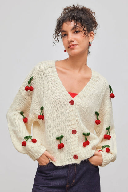 Apricot - Women's chunky knit V-neck cardigan featuring large front buttons and playful 3D crochet cherry appliqués scattered across a relaxed silhouette.