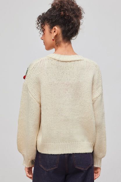 Apricot - Women's chunky knit V-neck cardigan featuring large front buttons and playful 3D crochet cherry appliqués scattered across a relaxed silhouette.