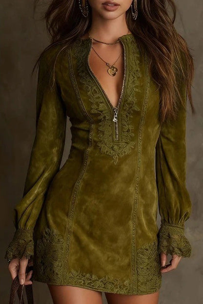 Green - Front view of a woman wearing a long-sleeved, fitted brown mini dress with a suede-like texture. The dress features a zip-front neckline, intricate floral embroidery on the bodice and seams, and wide lace trim on the cuffs and hem.