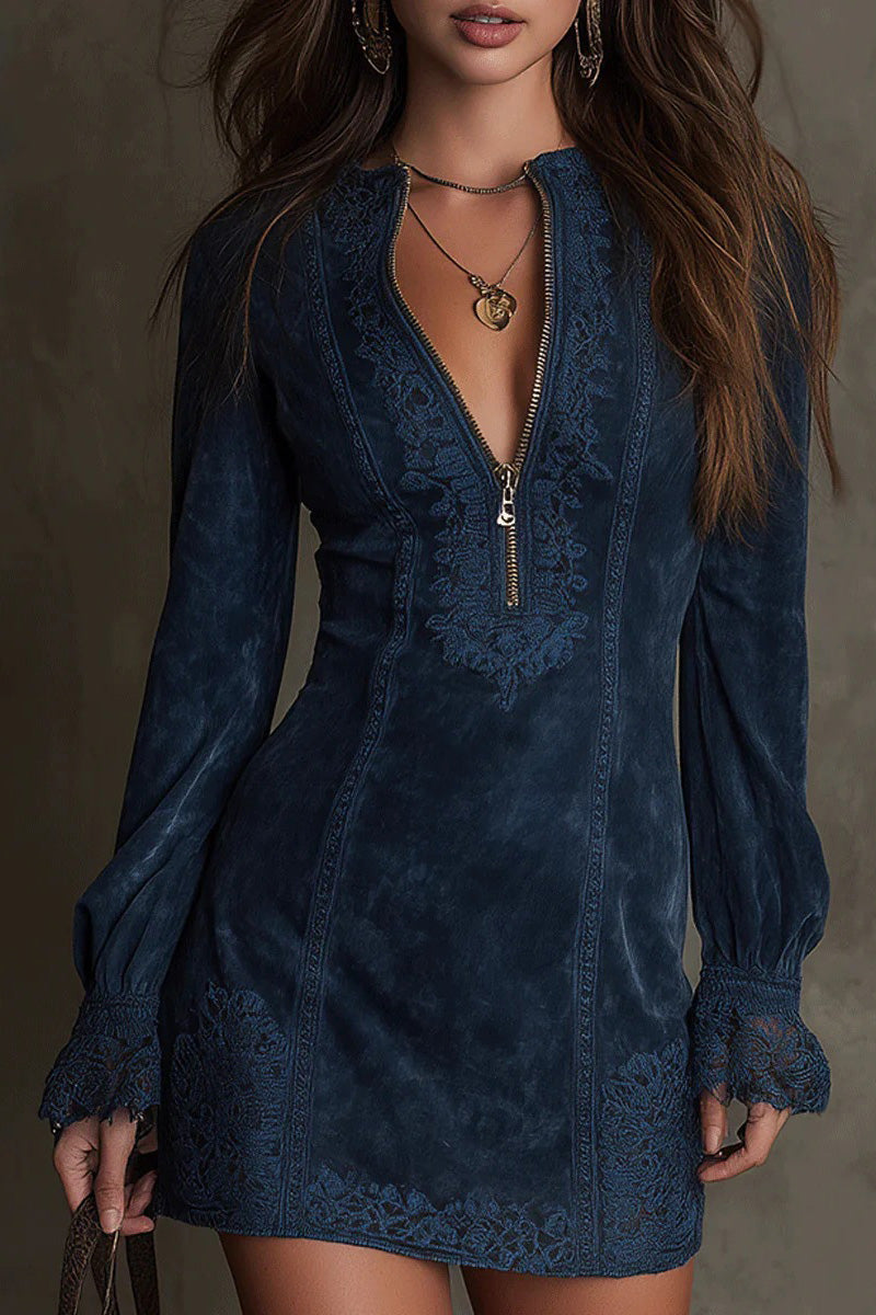 Blue - Front view of a woman wearing a long-sleeved, fitted brown mini dress with a suede-like texture. The dress features a zip-front neckline, intricate floral embroidery on the bodice and seams, and wide lace trim on the cuffs and hem.