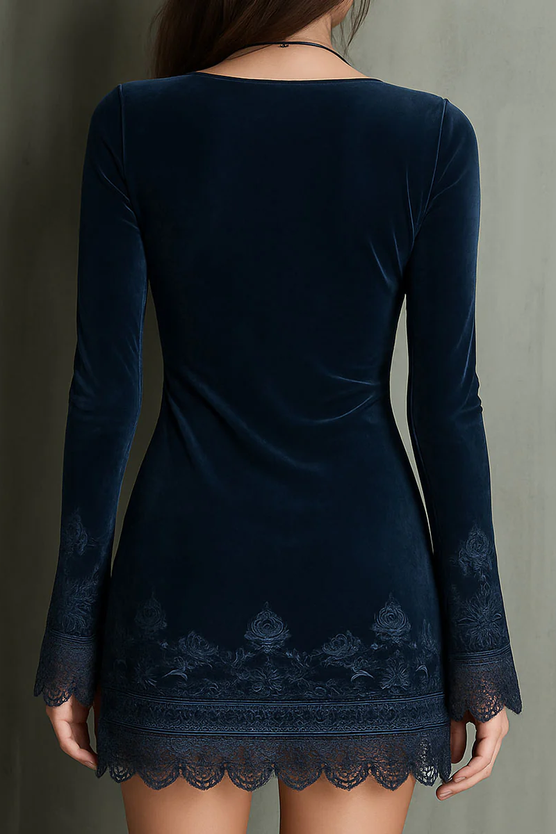 Navy - A woman shown from the chest down wearing a form-fitting, long-sleeve navy blue velvet mini dress. The dress features a V-neck, an empire waist, and flared sleeves with intricate floral embroidery and scalloped lace trim on the cuffs and hem.