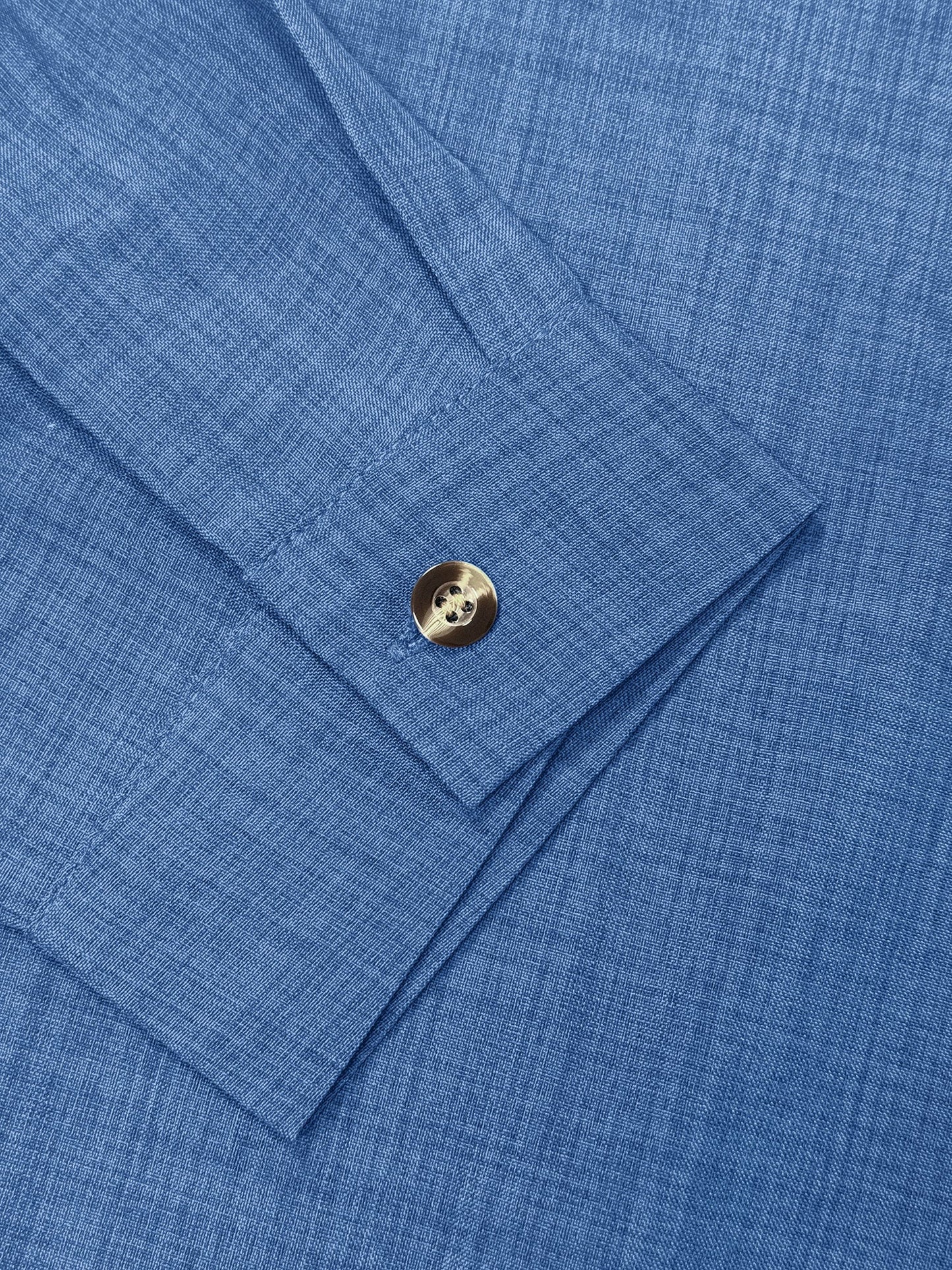 Blue - Women's light green long-sleeve button-down blouse with a collar and textured weave, styled tucked into white trousers.