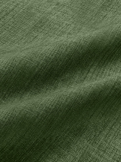 Green - Women's light green long-sleeve button-down blouse with a collar and textured weave, styled tucked into white trousers.