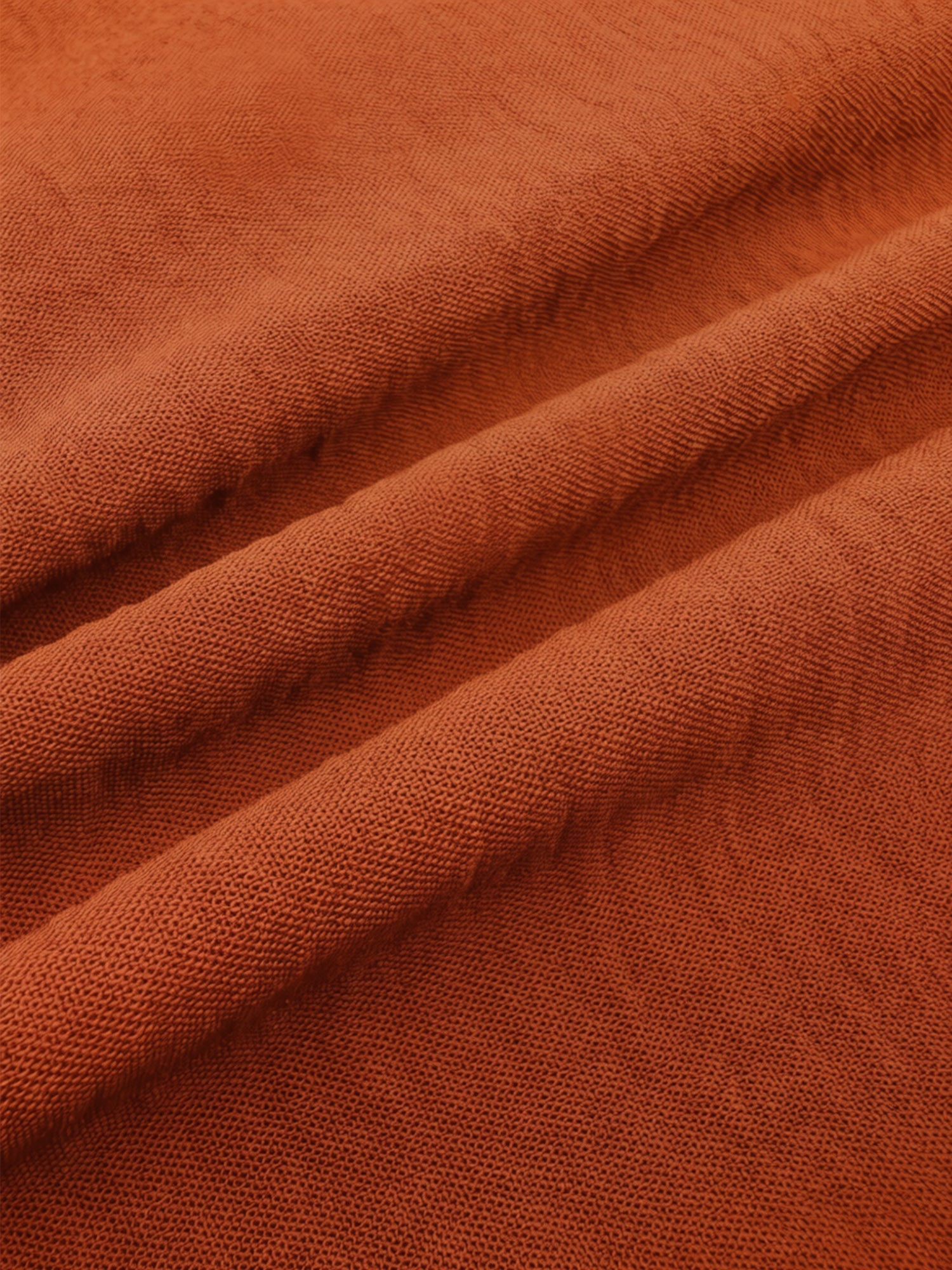 Brown - Women's rust orange short flutter sleeve blouse featuring a V-neckline, fabric-covered button front, and a tailored peplum waist, styled with blue jeans.