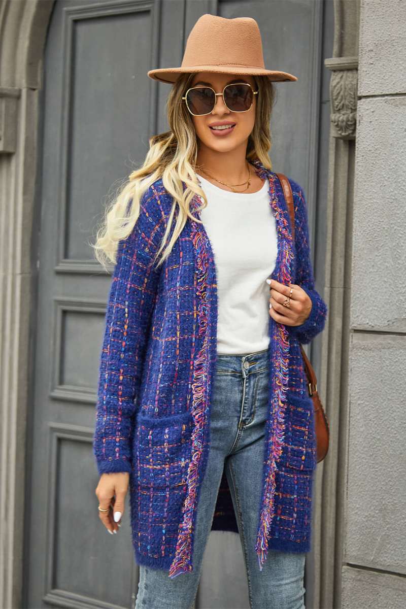 Blue - Women's longline open-front knit cardigan in a multicolored plaid pattern, featuring fringed trim and front patch pockets, styled with jeans and boots.