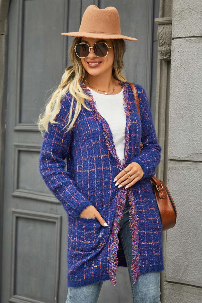 Blue - Women's longline open-front knit cardigan in a multicolored plaid pattern, featuring fringed trim and front patch pockets, styled with jeans and boots.
