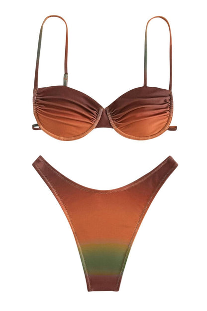 Full body shot of a woman wearing a red and orange gradient bikini set with a ruched bandeau top and high-cut bottoms.