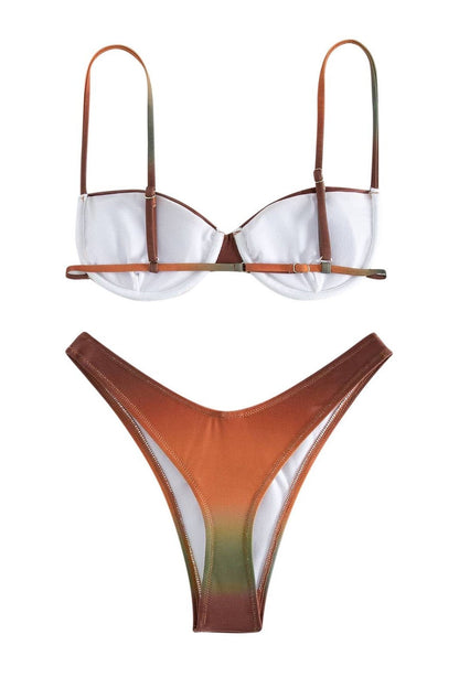 Full body shot of a woman wearing a red and orange gradient bikini set with a ruched bandeau top and high-cut bottoms.
