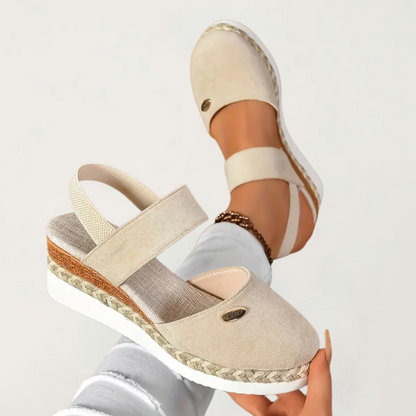 Beige - Women's canvas platform sandals featuring an elastic slingback strap, braided jute trim, and a metallic logo accent on a thick cushioned sole.