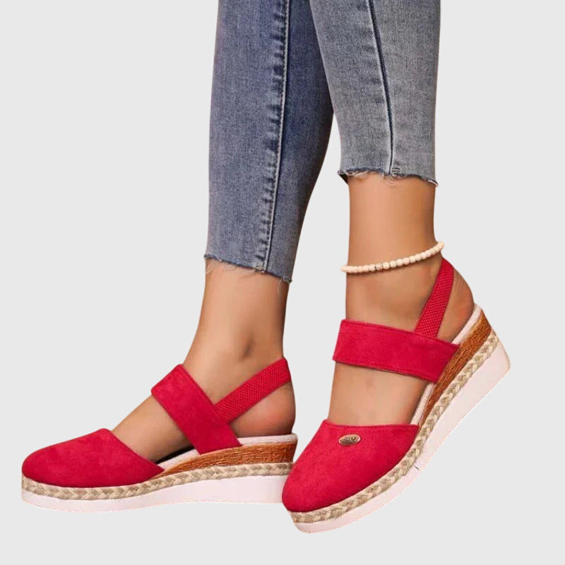 Red - Women's canvas platform sandals featuring an elastic slingback strap, braided jute trim, and a metallic logo accent on a thick cushioned sole.