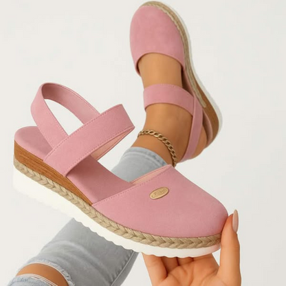Pink - Women's canvas platform sandals featuring an elastic slingback strap, braided jute trim, and a metallic logo accent on a thick cushioned sole.