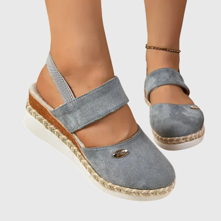 Gray - Women's canvas platform sandals featuring an elastic slingback strap, braided jute trim, and a metallic logo accent on a thick cushioned sole.