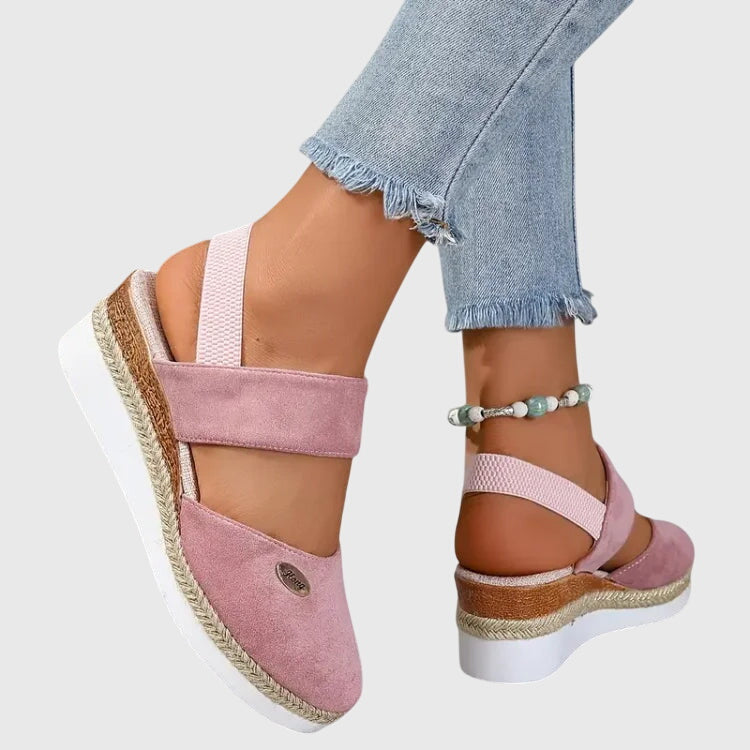 Blue - Women's canvas platform sandals featuring an elastic slingback strap, braided jute trim, and a metallic logo accent on a thick cushioned sole.