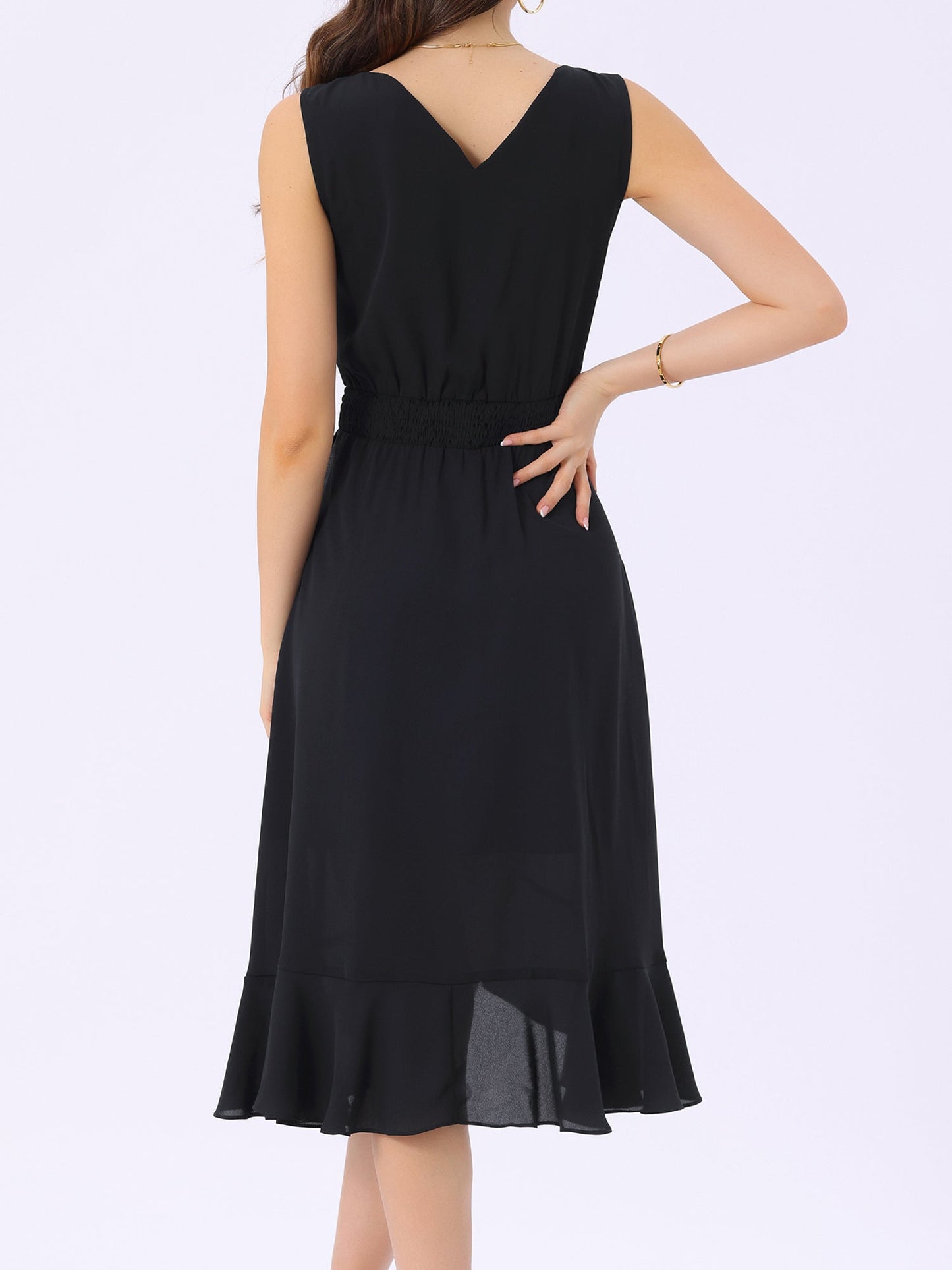 Black1 - Woman walking outdoors wearing a sleeveless floral chiffon midi sundress with an asymmetrical high-low ruffle hem.