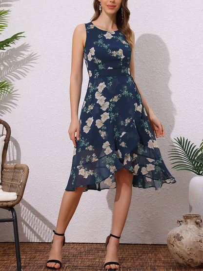 Dark Blue - Woman walking outdoors wearing a sleeveless floral chiffon midi sundress with an asymmetrical high-low ruffle hem.