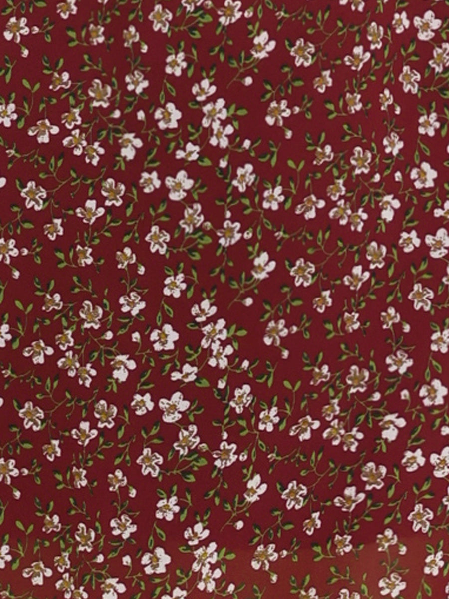 Wine Red - Woman walking outdoors wearing a sleeveless floral chiffon midi sundress with an asymmetrical high-low ruffle hem.
