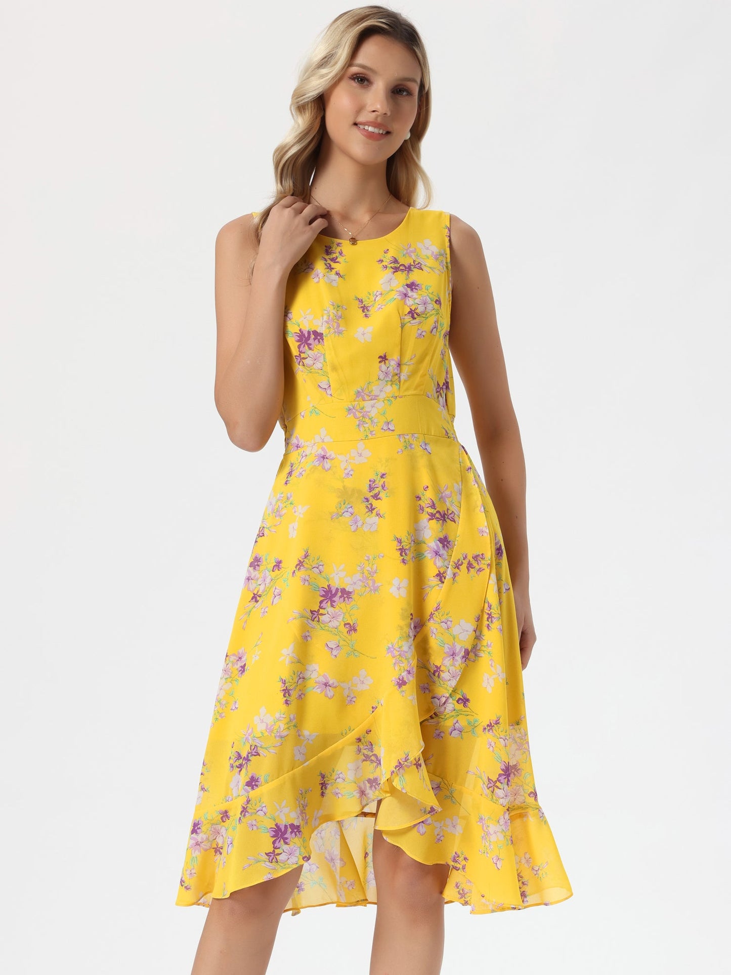 Yellow - Woman walking outdoors wearing a sleeveless floral chiffon midi sundress with an asymmetrical high-low ruffle hem.