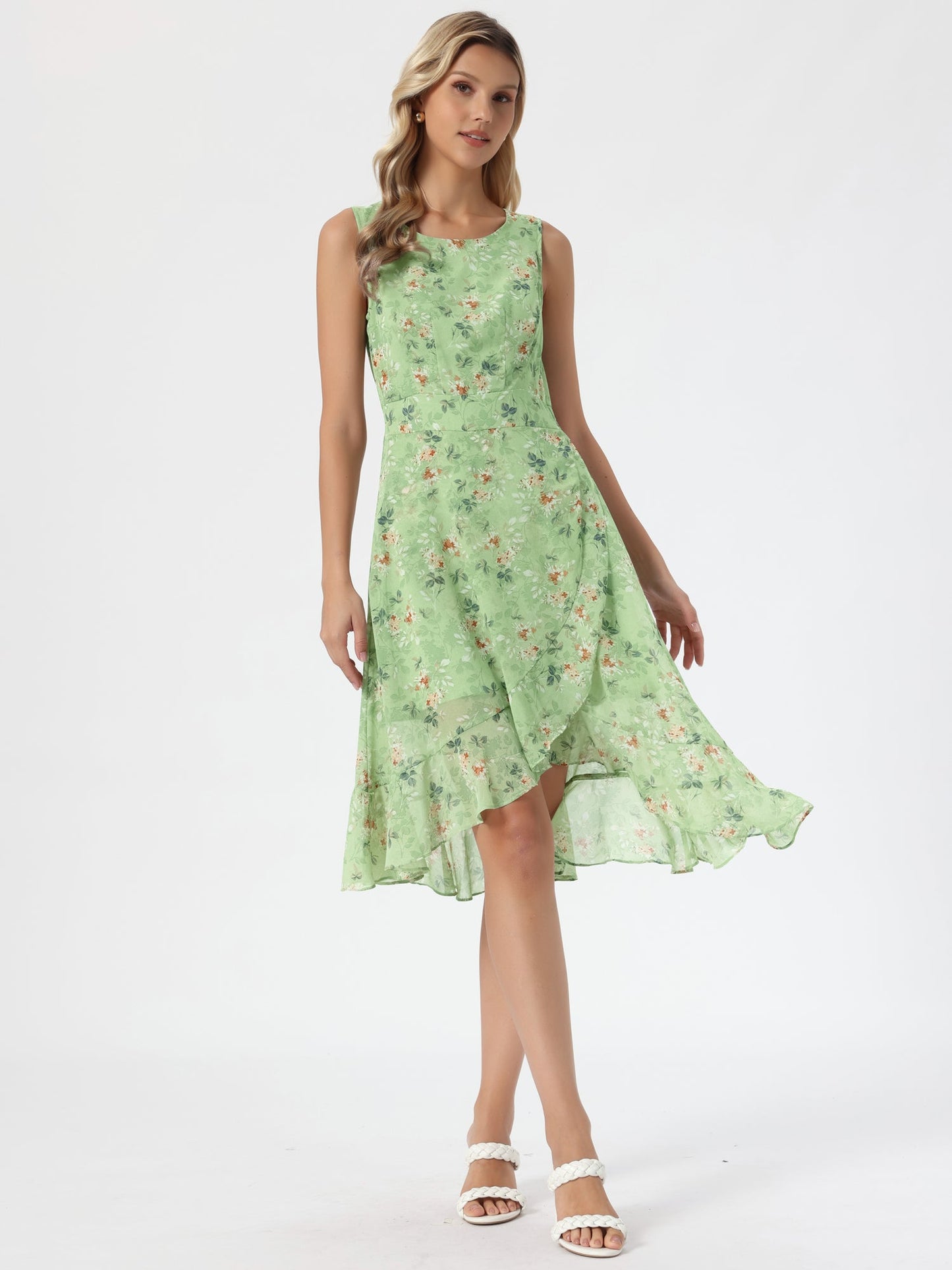 Green - Woman walking outdoors wearing a sleeveless floral chiffon midi sundress with an asymmetrical high-low ruffle hem.