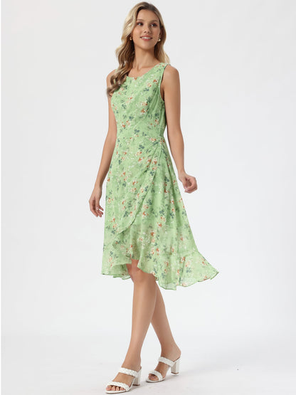 Green - Woman walking outdoors wearing a sleeveless floral chiffon midi sundress with an asymmetrical high-low ruffle hem.