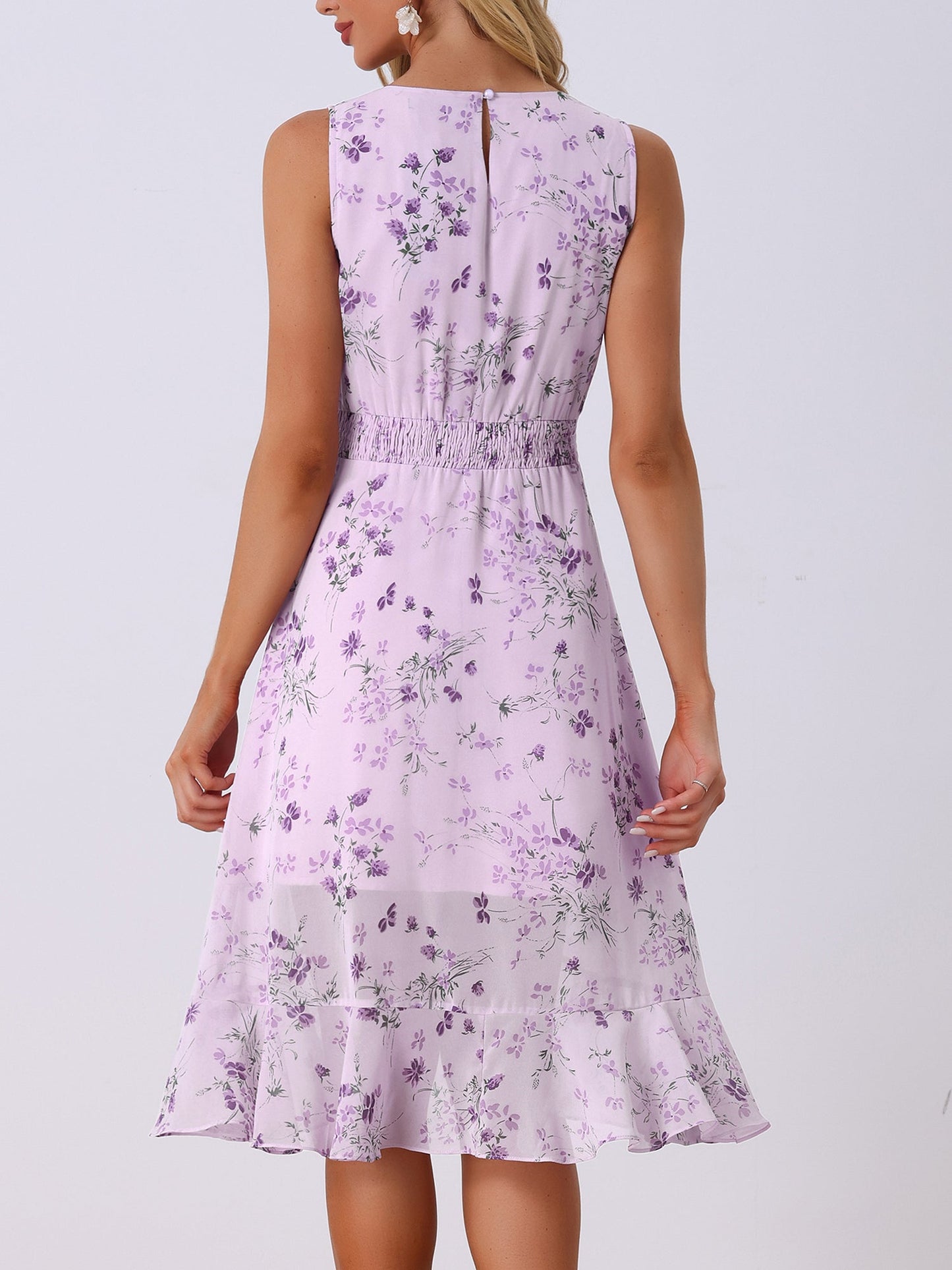 Purple - Woman walking outdoors wearing a sleeveless floral chiffon midi sundress with an asymmetrical high-low ruffle hem.