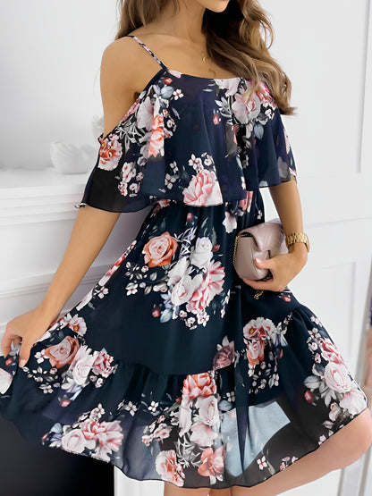 Black - Woman wearing a floral print mini sundress with spaghetti straps, a large ruffle bodice overlay, and a tiered skirt