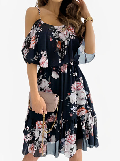 Black - Woman wearing a floral print mini sundress with spaghetti straps, a large ruffle bodice overlay, and a tiered skirt