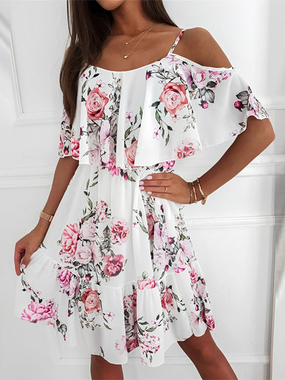White - Woman wearing a floral print mini sundress with spaghetti straps, a large ruffle bodice overlay, and a tiered skirt