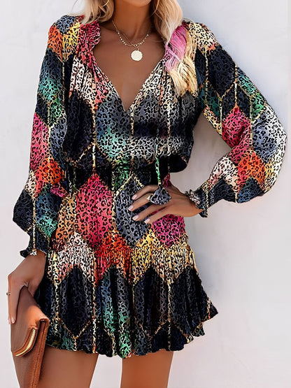 Black - Woman wearing a lightweight leopard print mini dress with long sleeves, a v-neckline with ties, a smocked waist, and a tiered ruffled skirt