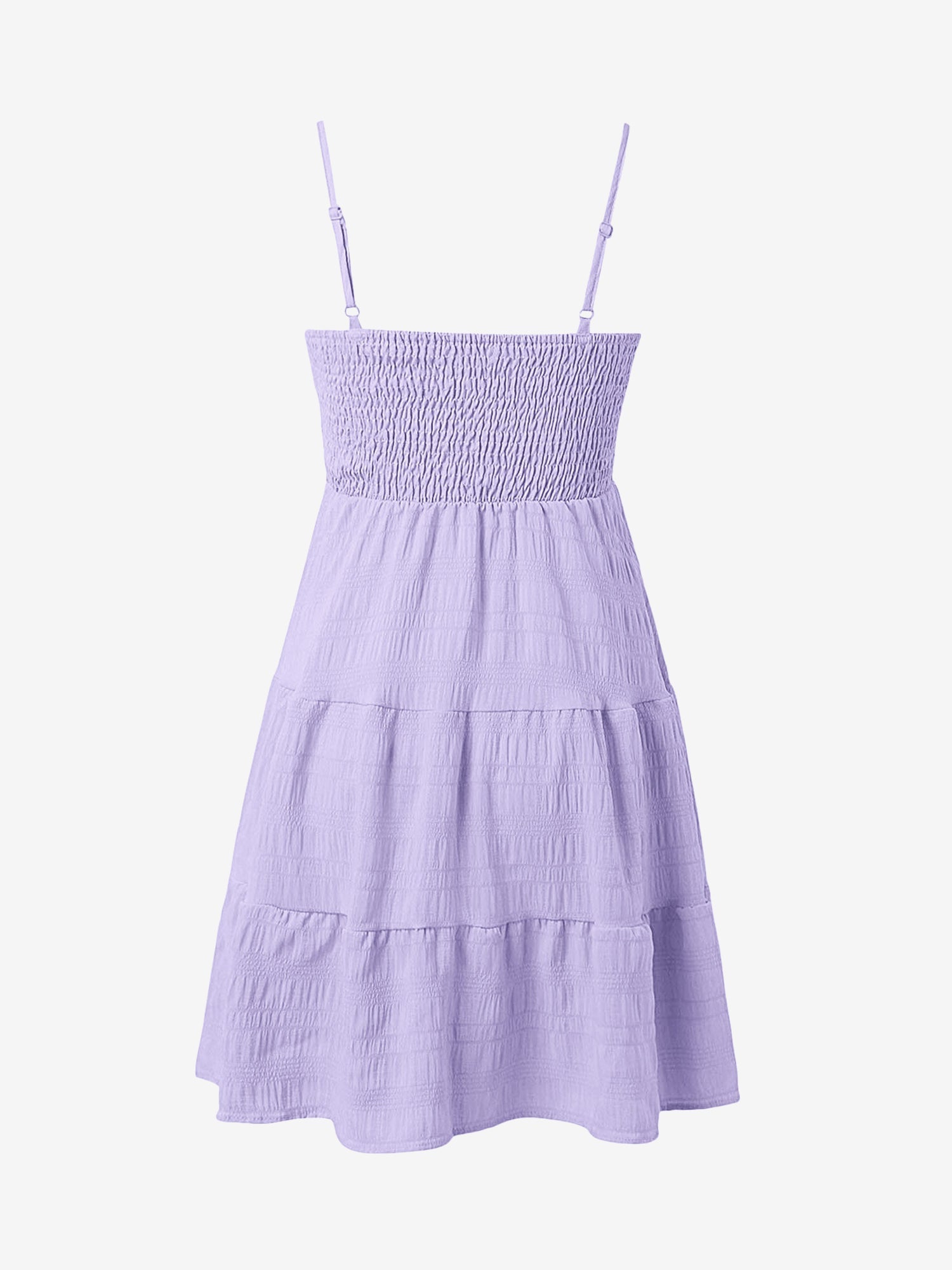 Light Purple - Woman wearing a textured smocked bodice mini dress with spaghetti straps and a tiered skirt
